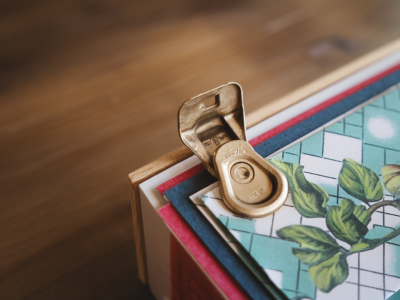 How to make a hidden hinge for a secret flap using a soda can tab and scrapbook paper