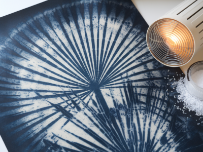How to fake sun‑bleached cyanotype textures on paper props using tea, sunlamps and subtle salt washes